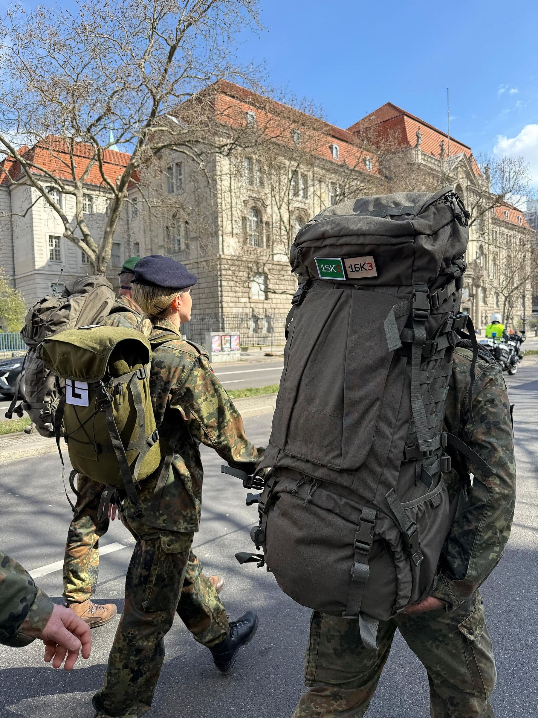 German soldiers carrying heavy packs on a march.