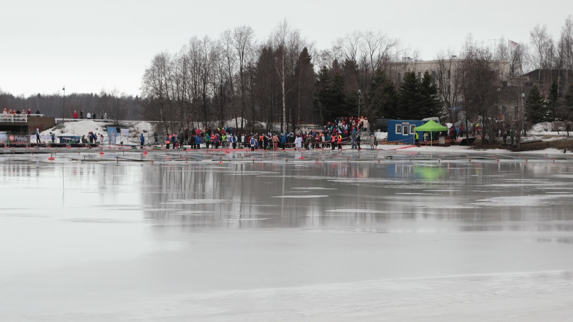 Ice-swimming event in a hole cut in a frozen lake, Oulu, Finland.