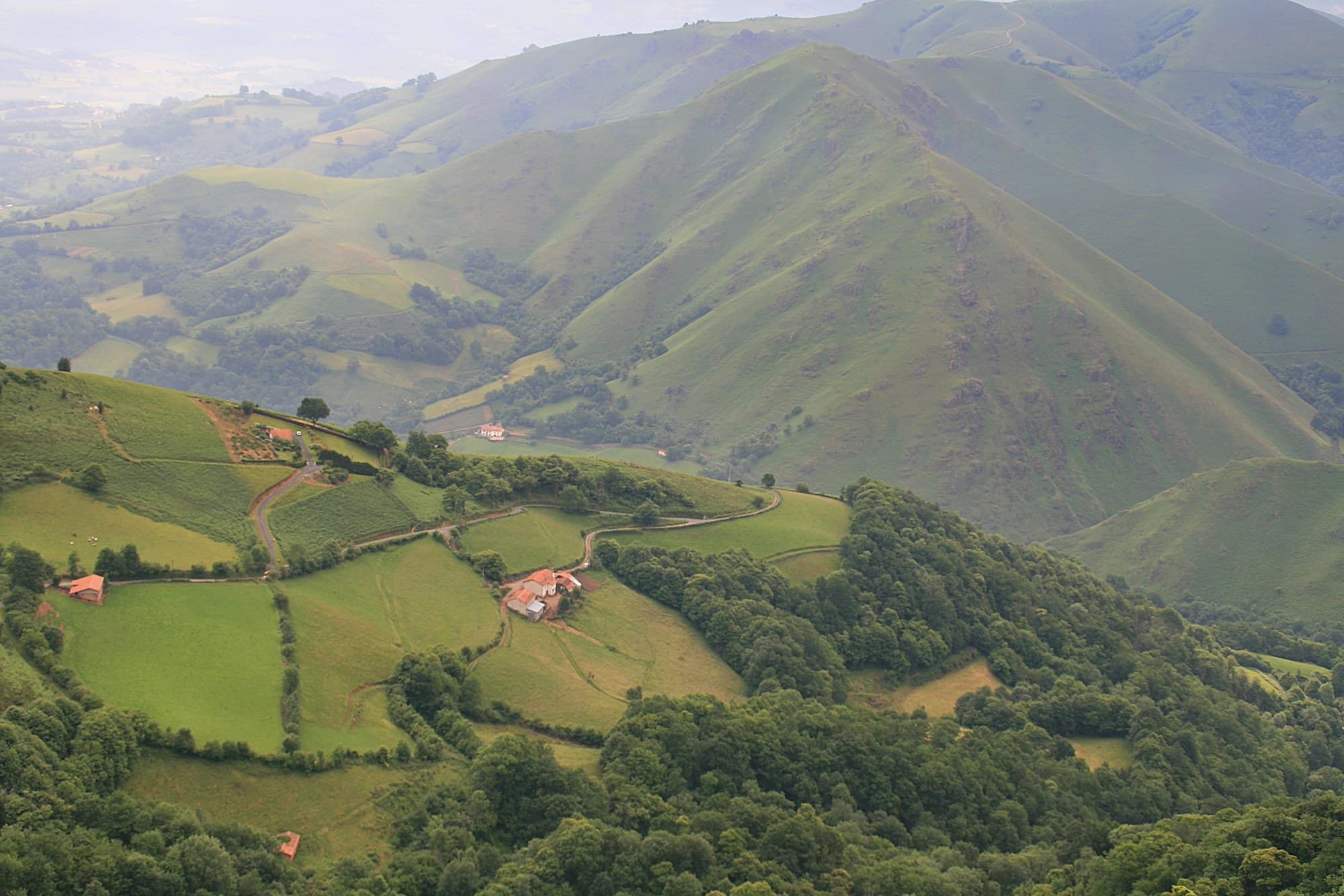 Green ridges of the Pyrenees on the route from Saint-Jean-Pied-de-Port to Roncesvalles.